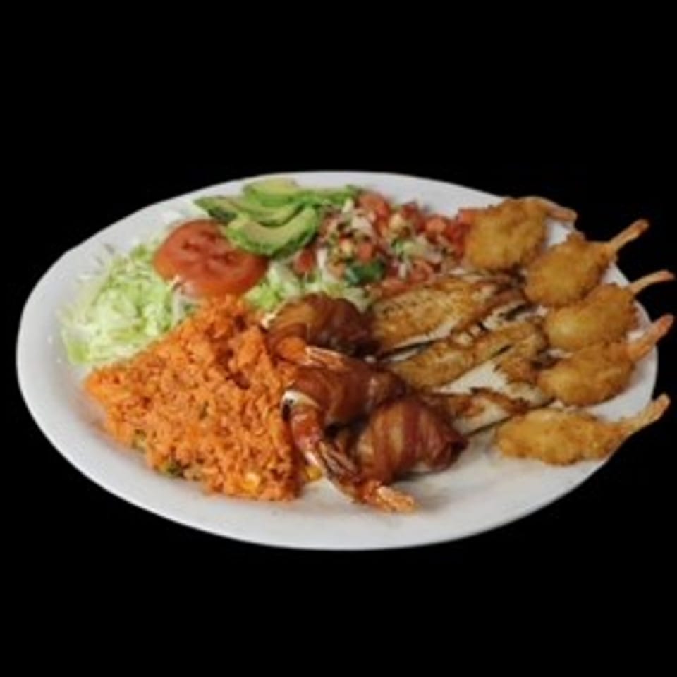 A white plate with Mexican rice, salad, avocado, pico de gallo, fried fish, and shrimp.