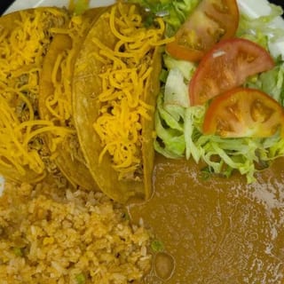 35. 3 Crispy Beef Tacos, Spanish Rice, Refried Beans, and Salad